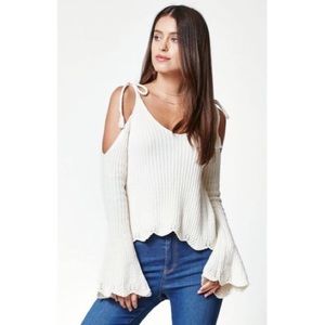 Tie strap cold shoulder sweater in cream. Size M